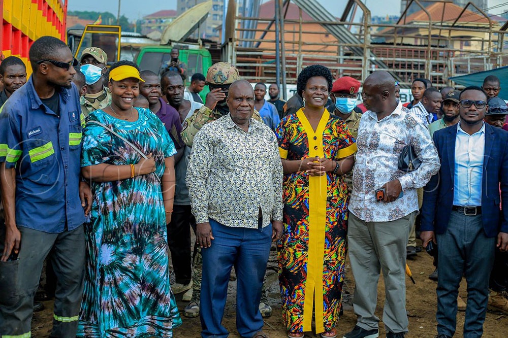Mechanics interact with Seku during on of her tours to their work places. 
