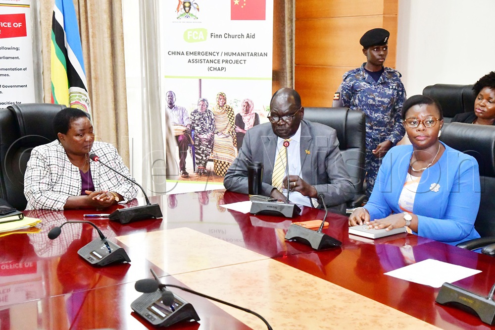 Rt Hon. Robinah Nabbanja (left) Prime Minister of the Republic of Uganda and Minister of State for Relief, Hon. Eng. Hilary Onek (centre), Minister for Relief, Disaster Preparedness and Refugees and Hon. Dr. Lillian Aber (right) and Minister of State for Relief, Disaster Preparedness and Refugees, during the launch of the OPM-China Emergency Humanitarian Cash Assistance Project. (Credit: Mpalanyi Ssentongo)