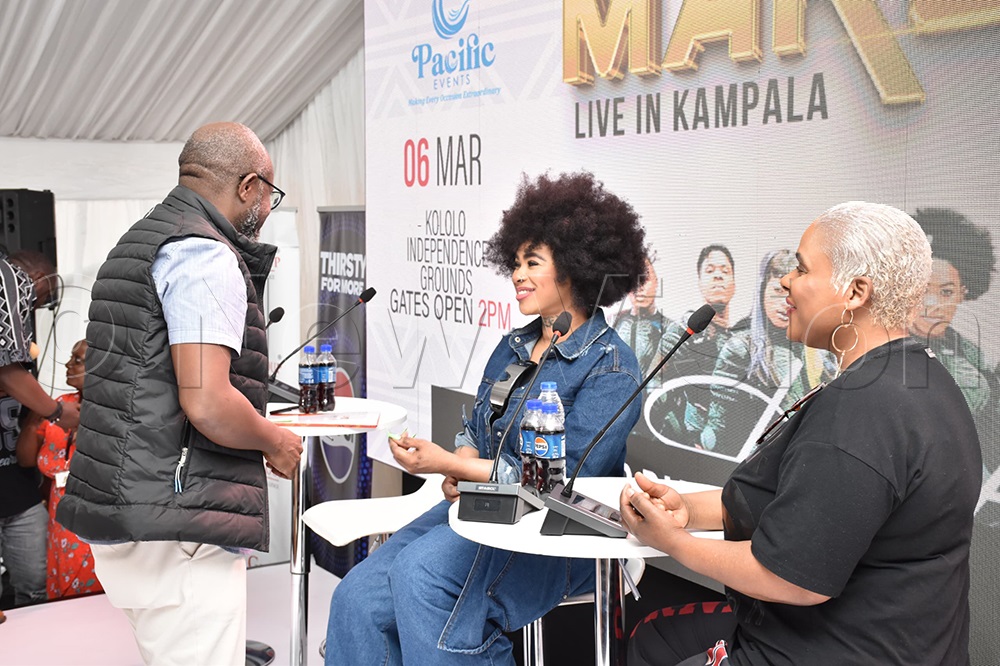 Vision Group CEO Don Wanyama sharing a light moment with Makoma at the press briefing.