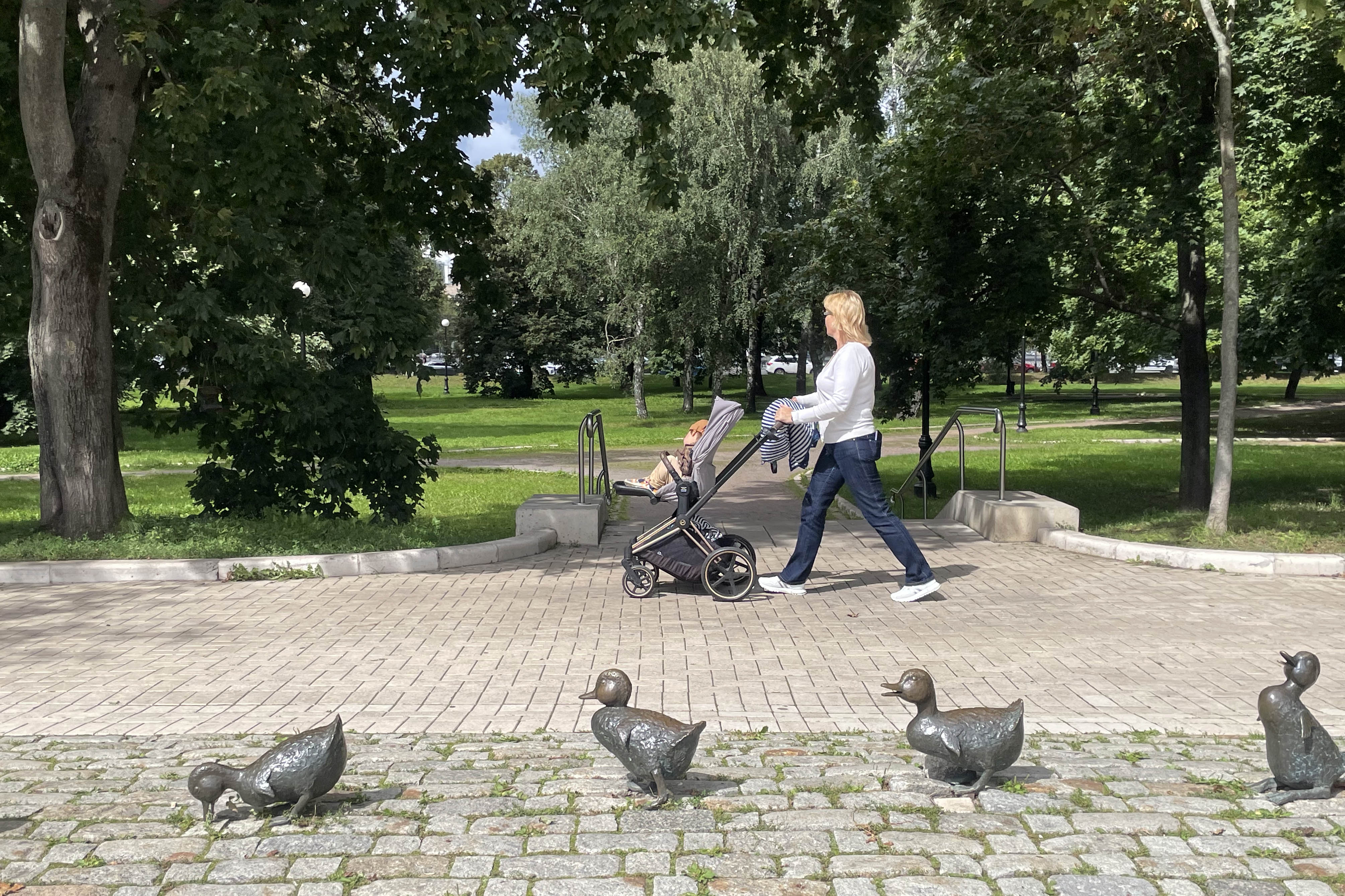 A lady takes a walk near Novodevichy Convent gardens in Moscow.
