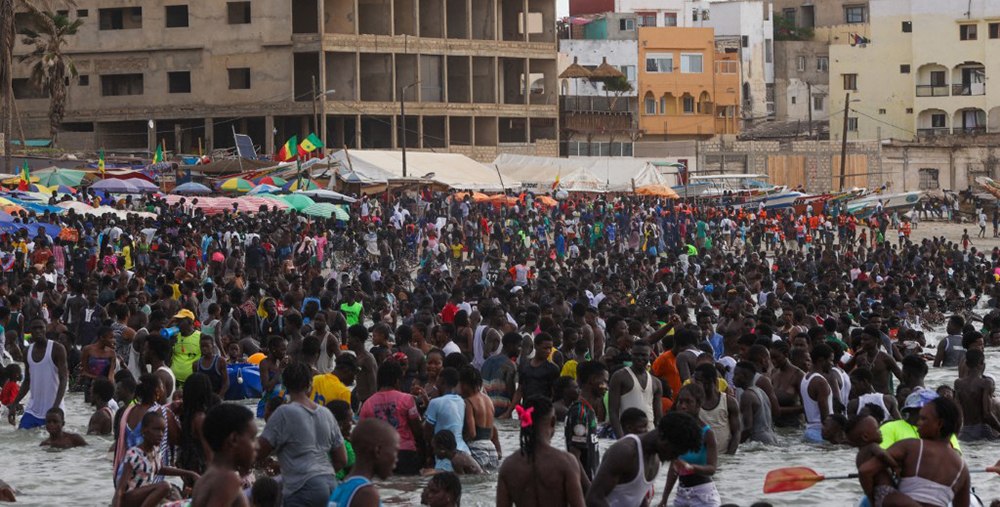 JULY 13: Locals swim at Ngor Beach to cool off in the summer heat, in Dakar, Senegal in July. (AFP Photo)