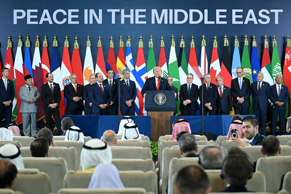 US President Donald Trump (C) speaks during the Sharm El-Sheikh Peace Summit in the Egyptian Red Sea resort town of Sharm el-Sheikh on October 13, 2025. Trump on October 13 hailed a Gaza summit in Egypt as a "tremendous day" for the Middle East, saying a document would be signed on "rules and regulations" for future talks. (AFP)