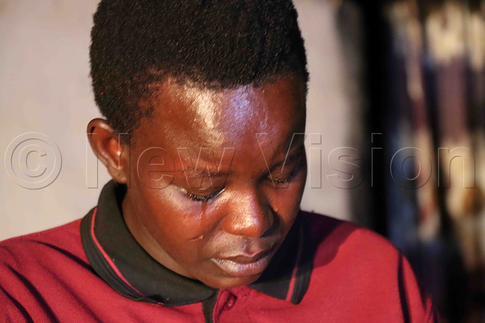 Emotional moment: Kela Obura sheds tears as she narrates what happened to her son. (Credit: Hudson Apunyo)