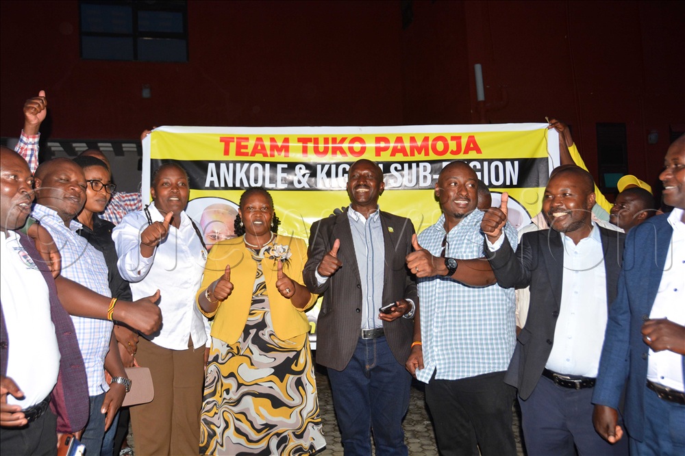 The senior presidential adavisor on agriculture and rural development Peace Rugambwa (fifth left) pose for a group photo with PLU and NRM leaders after a meeting at Dream Wood Suites in Mbarara City on Friday November 7, 2025.