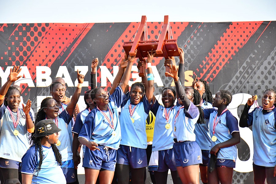 Thunderbirds celebrating with their trophy after emerging winners of the Kyabazinga Sevens womens' category at Kyabazinga stadium in Bugembe on Sunday. Photo by Donald Kiirya