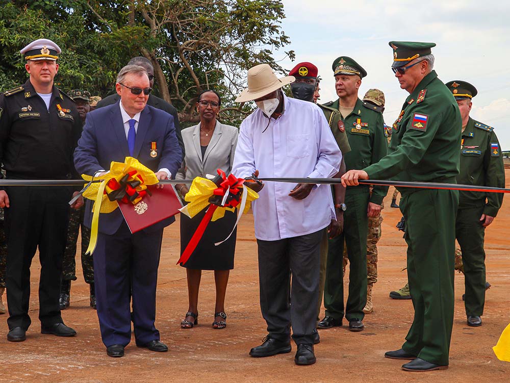President Museveni (2nd R) cutting the ribbon as Vladlen Semivolos, Russia Ambassador to Uganda, looks on during the handover ceremony of the military equipment donated by Russia Federation to Uganda at Gaddafi Military Barracks, on October 26, 2025. (Credit: PPU)