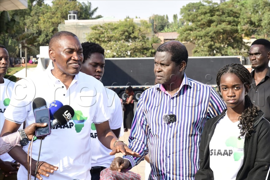 Pastor Robert Kayanja and Lt. Col. Frank Musisi address the press at the Miracle Centre Church in Lubaga after the donation. (All Photos by Eddie Ssejjoba)