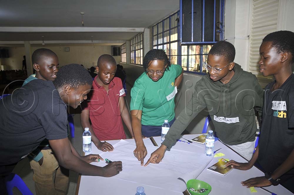 Peer educator Lillian Mpabulugi takes teens through a session during the Real Talk for Teens workshop. (Credit: Wilfred Sanya)