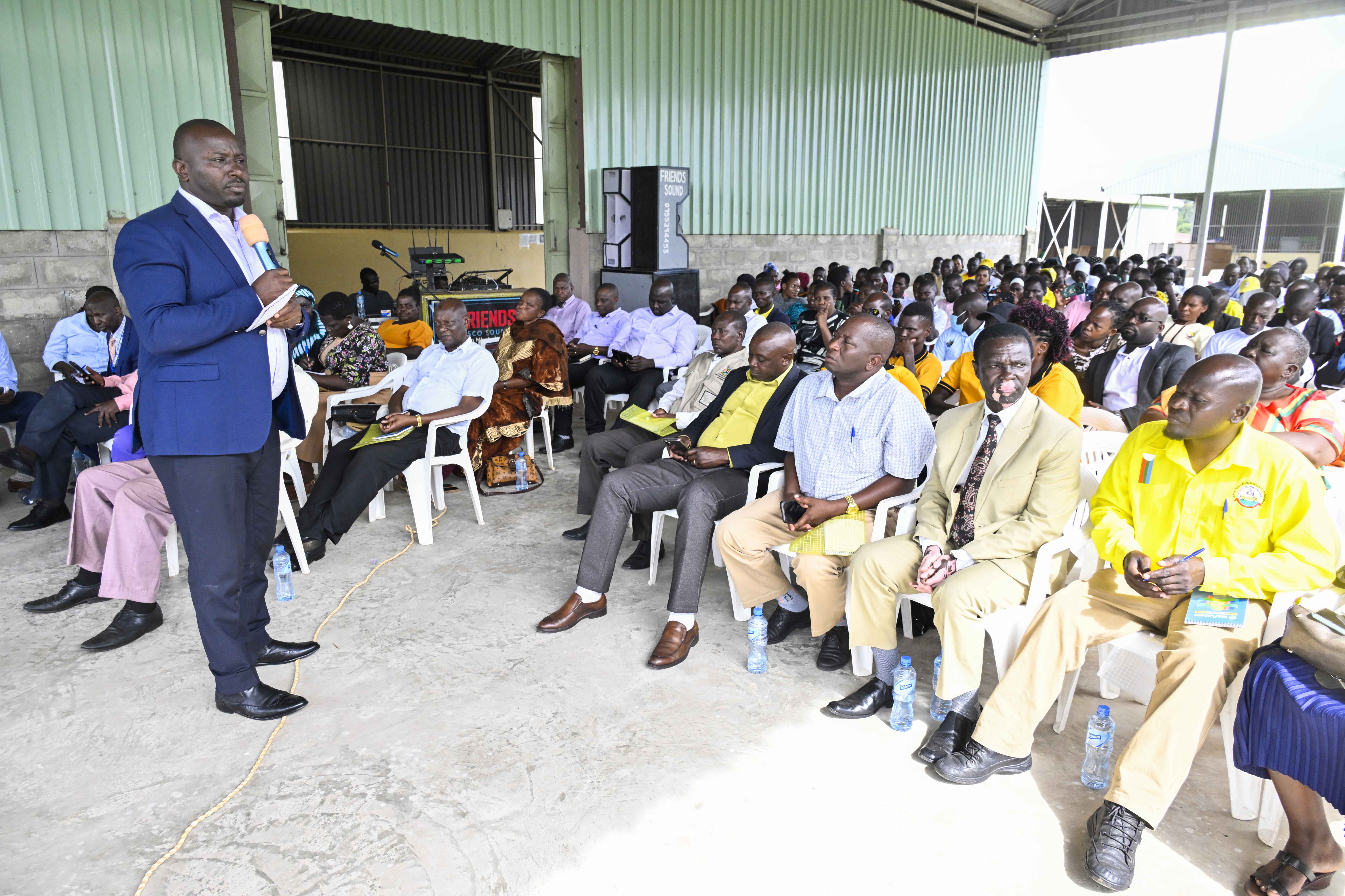 The Director of Industrial Hubs and Presidential Projects at State House Eng. Raymond Kamugisha giving a lecture during a Training to Regional President Industrial hubs of Bukedi, Busoga and Bugisu SACCO leaders on Management of the SACCO funds from President Yoweri Kaguta Museveni at Bukedi sub-region Industrial hub in Lwatama sub-county, Kibuku district.