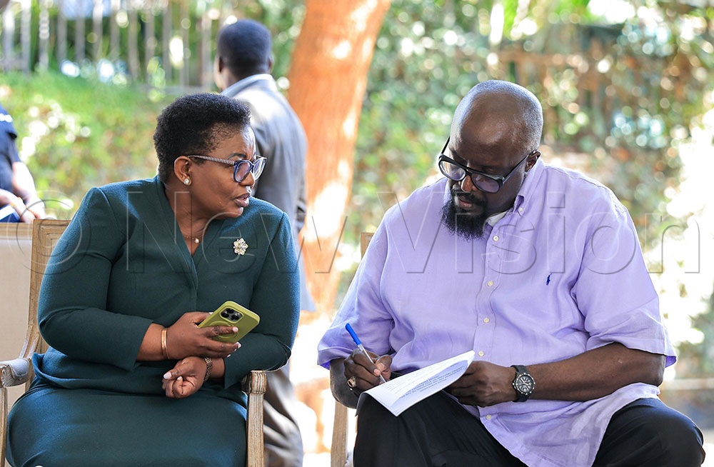 The Minister of Information and Communication Technology (ICT) and National Guidance, Justine Kasule Lumumba, interacting with Alan Kasujja, the Executive Director Uganda Media Centre. This was during a press conference at the Uganda Media Centre on September 1, 2026. (Credit: Nancy Nanyonga)