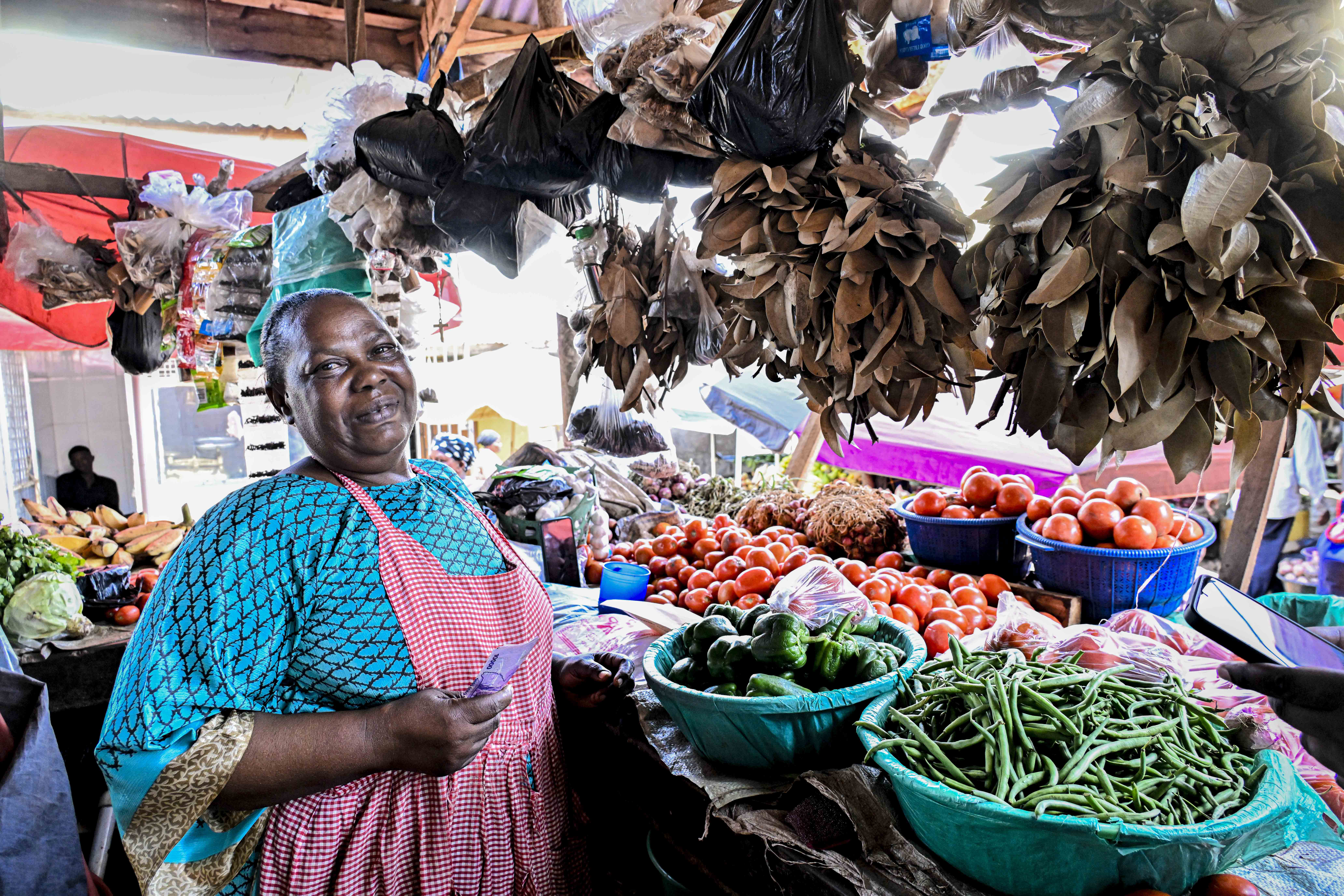 Namutebi Coster a former bush war fighter of the NRA and a vegetable and spices seller was excited and thanked President Yoweri Kaguta Museveni for the financial support. (Photo by PPU/Tony Rujuta)