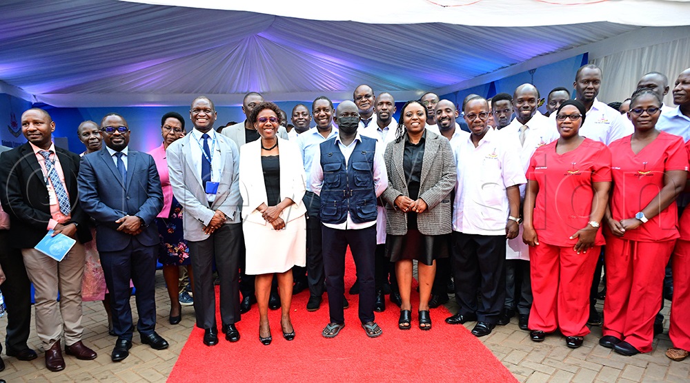The first bone marrow transplant patient Sande Stephen (center) shares a group picture with Health minister Ruth Aceng, UCI Board Chairperson Prof. Damalie Nakanjako, UCI ED Dr Jackson Orem other medical officers This was at the UCI in Mulago on April 24, 2026. (Photo by Maria Wamala)
