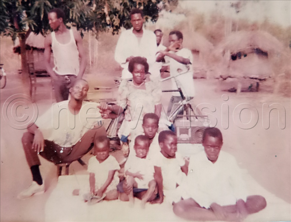 Acaye (seated right) with his parents, brothers and sisters on the Christmas of 1993. 