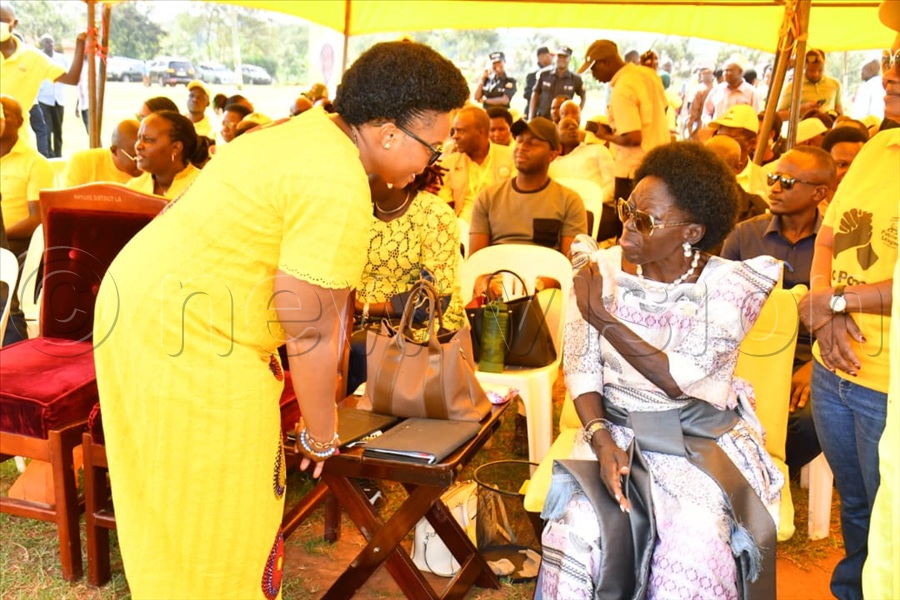 First Deputy Prime Minister Rebecca Alitwala Kadaga (right) chatting with lands minister Persis Namuganza at the Mayuge campaign rally.