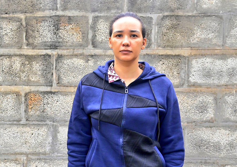 Elizabeth Esther Steenkamp (extreme end in a black hoodie) a Kenyan national, and Managing Director of Washa Lidjiwe Investments Limited was charged before the Makindye Chief Magistrate’s Court. (Courtesy photo)