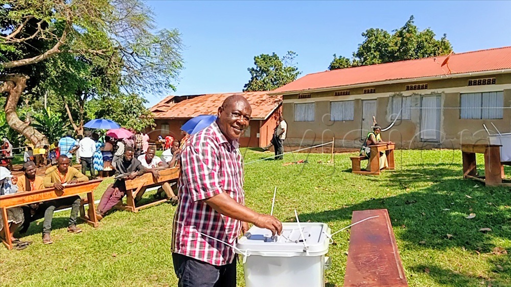 Minister Sam Mayanja voting at East ward in Mityana town council. (Credit: Luke Kagiri)