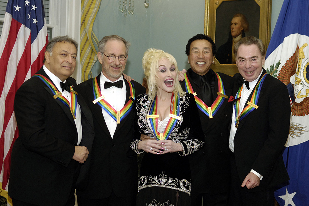 Kennedy Center Honors recipients (L/R) Zubin Mehta, Steven Spielberg, Dolly Parton, Smokey Robinson, and Andrew Lloyd Webber, pose for photos after recieving the award at the State Department during a dinner hosted by Secretary of State Condoleezza Rice, in Washington, DC on December 2, 2006. (Credit: AFP)
