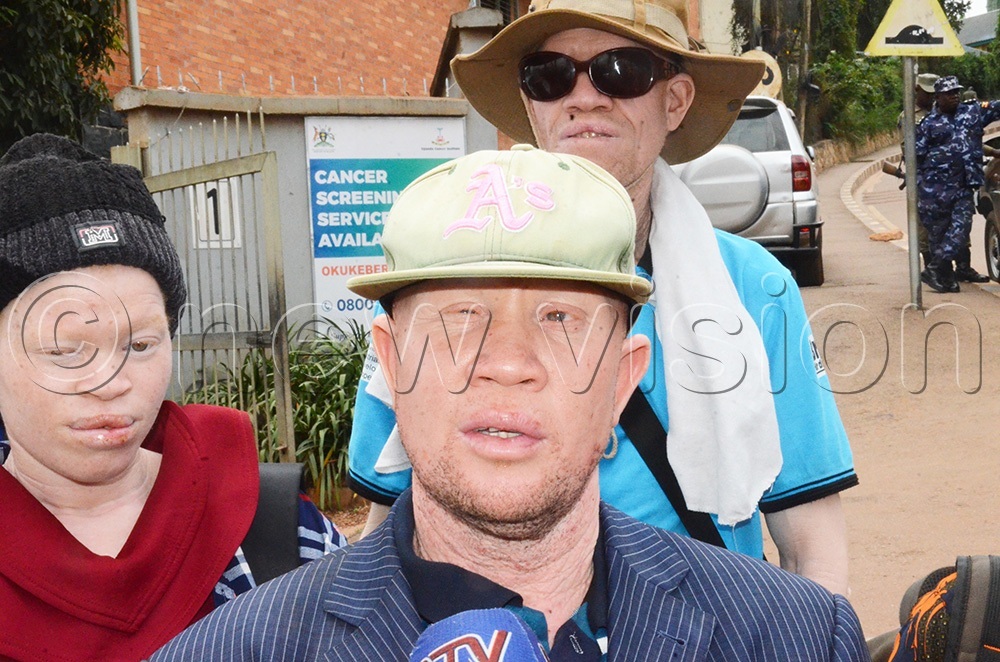 Jude Sebyanzi, the Uganda Albinos Association (UAA) Executive Director addressing the media about the issues affecting albinos before handing over the petition to the executive director of the Uganda Cancer Institute (UCI), Dr Jackson Orem on Wednesday June 10, 2026. (Photo by Isaac Nuwagaba)