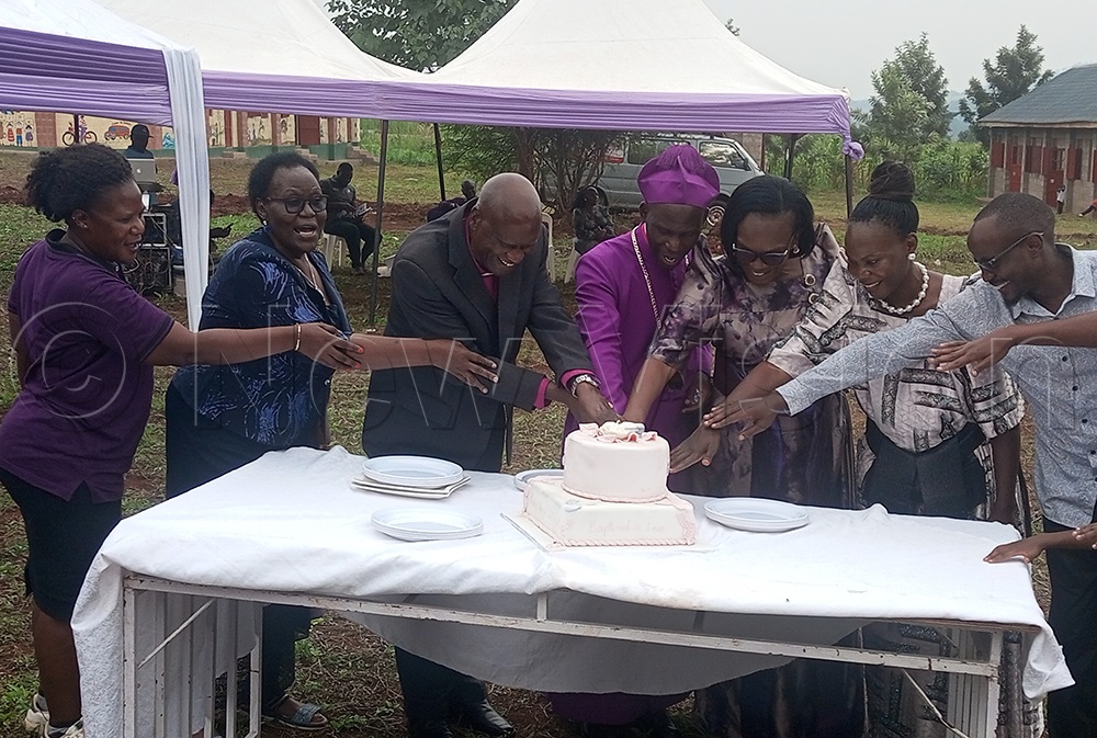 Bishop Prof. Grace Lubaale, wife Claire Lubaale, Bishop Emeritus Dr Micheal Kyomya & Retired Supreme Court Judge, Can. Lady Justice Faith Mwondha cut cake at the occasion. (Credit: Tonny Nsoona)