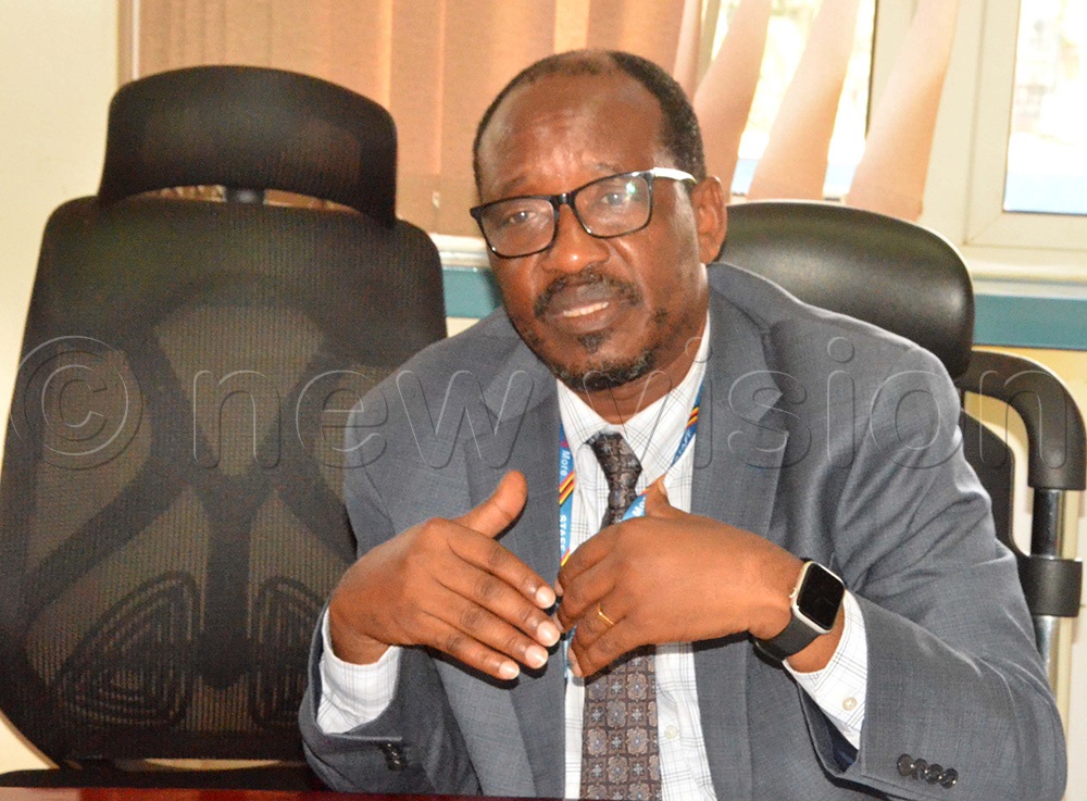 Anthony Kintu Mwanje, the head of the PSD Secretariat at the finance ministry, addressing the press at their office at Crested Towers. (Photo by John Ricks Kayizzi)