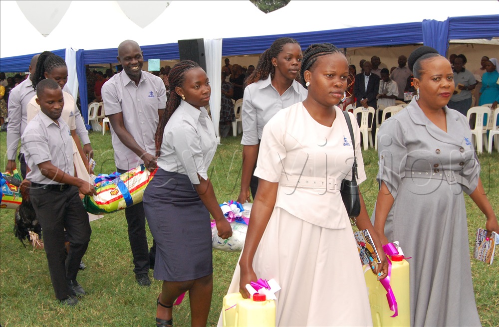 The staff-members carrying offertory during mass.