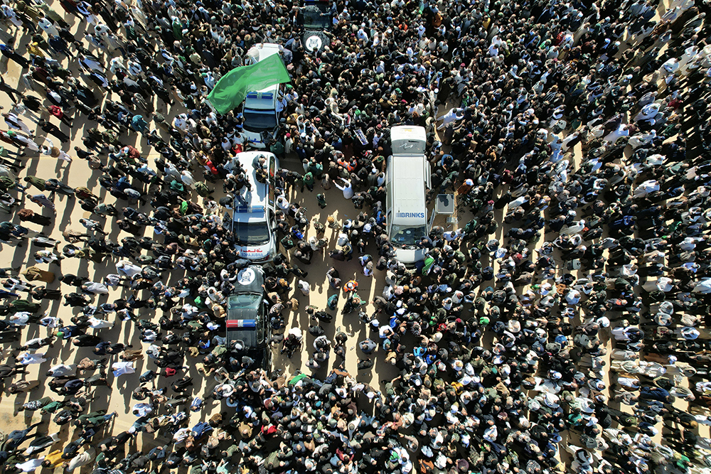 This aerial picture shows Libyans gathered for the funeral of Seif al-Islam Gaddafi, the son of Libya's late longtime ruler, in Bani Walid, in the Tripoli region, western Libya on February 6, 2026. (AFP)