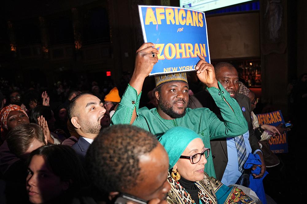 Supporters of New York City Mayoral candidate Zohran Mamdani celebrate during an election night event at the Brooklyn Paramount Theater in Brooklyn, New York on November 4, 2025.
