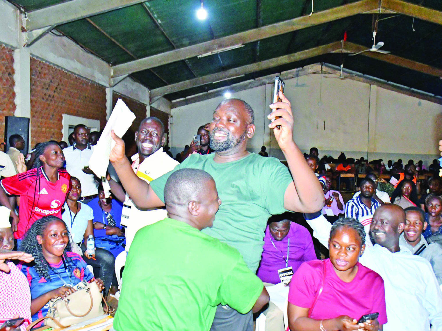 National Unity Platform&rsquo;s Dr Timothy Batuwa Lusala (middle) jubilating with his supporters after being declared MP-elect of the Jinja South West Constituency at the Jinja tally centre at Jinja Senior Secondary School on Friday.