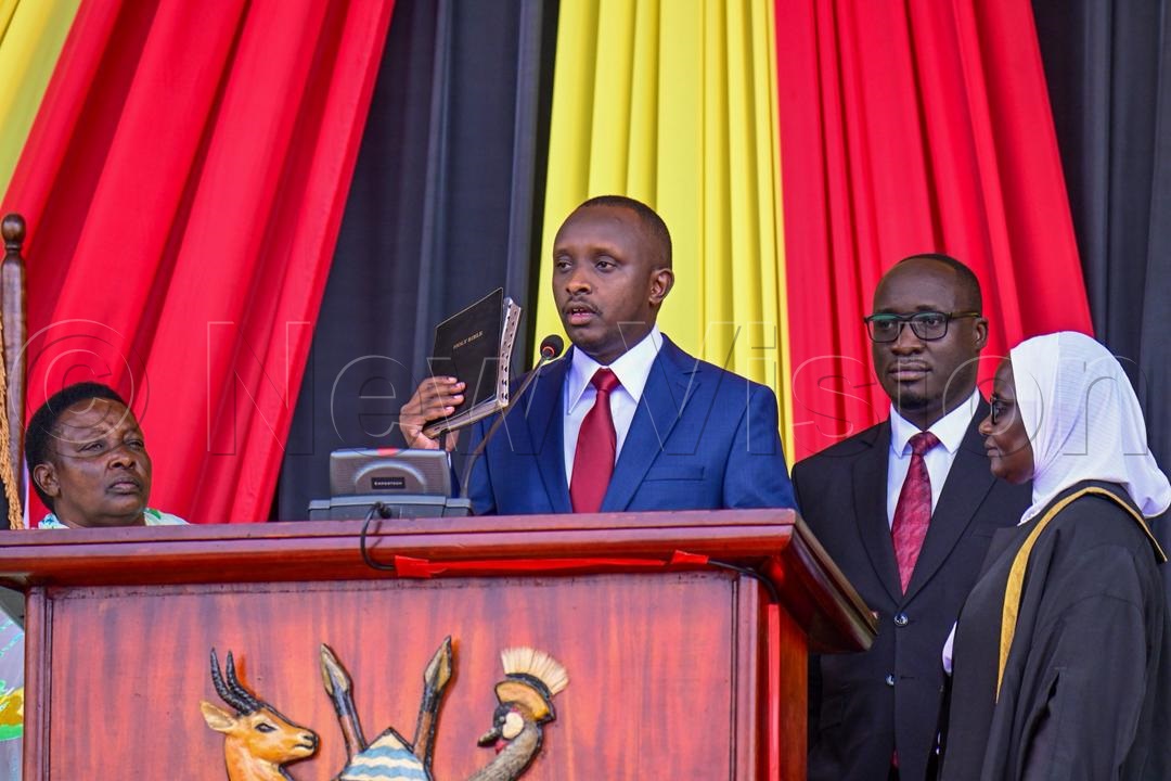Kenan Opio taking the oath as Member of Parliament for Busiro South in the 12th Parliament. (Photo by Miriam Namutebi)