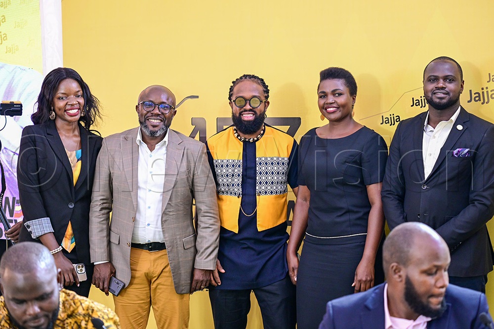 Vision Group CEO, Don Wanyama, in a group photo with guest at the event. (Credit: Miriam Namutebi)