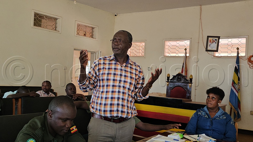 Mukhwana Wekhoola Koloto, the chairperson of the National Resistance Movement (NRM) in Bududa speaking during the meeting