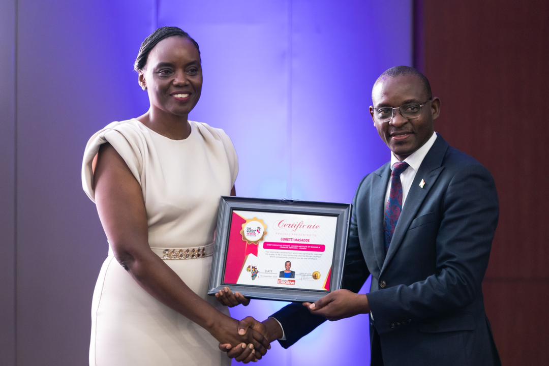 Uganda Institute of Banking and Financial Services (UIBFS) chief executive officer Goretti Masadde receiving the award.