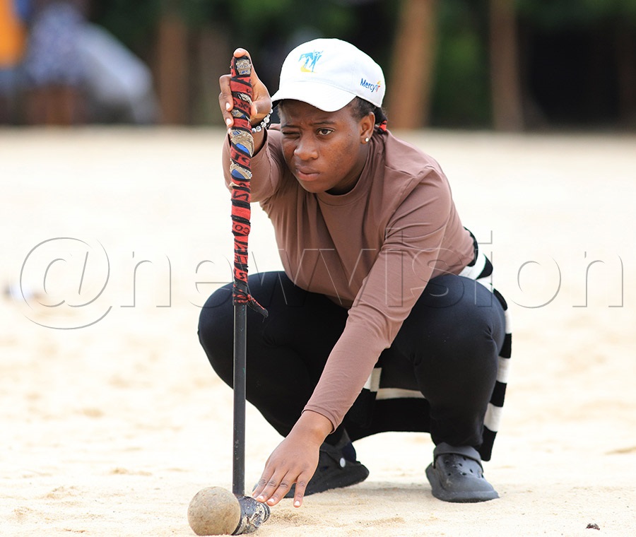 Teddy Nassuna of the University of Kisubi in action during the Beach Woodball Open at Bunjako Beach in Buwama, Mpigi District, on Sunday