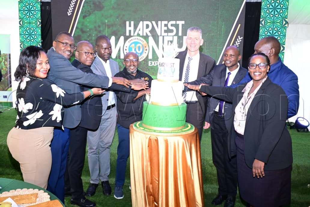Cake cutting group photo after the launch of the 10th edition of Harvest Money Expo.