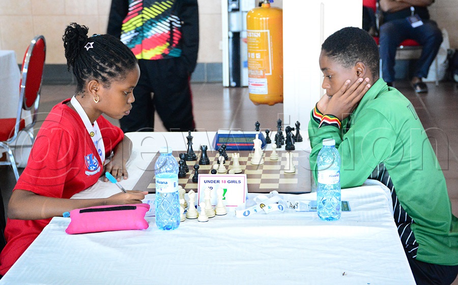 Uganda's KEZA Katongole (left) registers her moves against Zambian Carol Ndolvu during the Africa Youth Chess Championship at the Imperail Botanical Beach Hotel, May 19, 2026. Photo by Michael Nsubuga