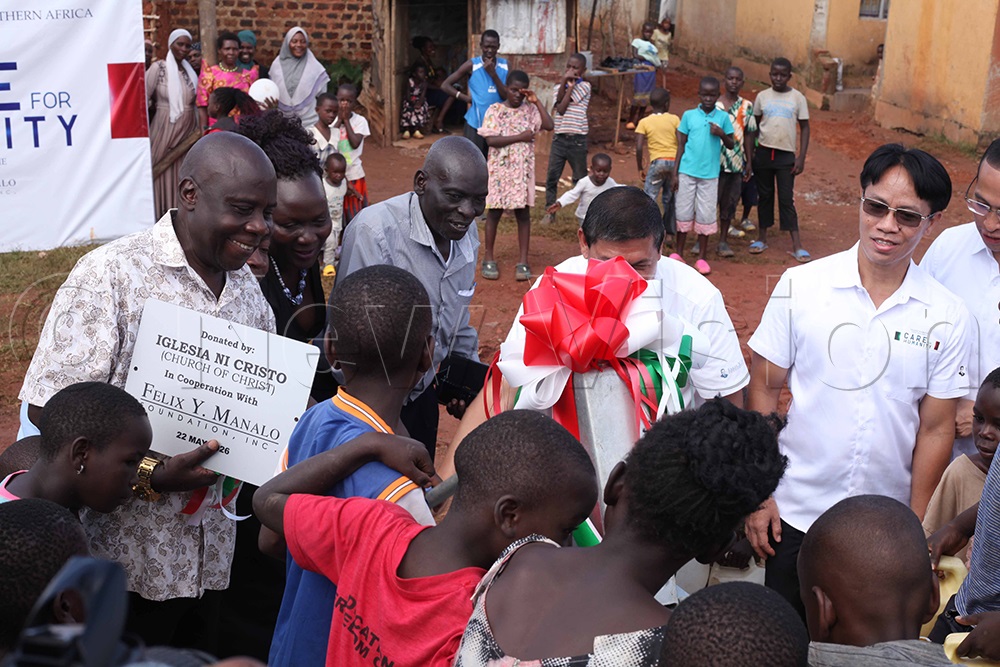 Children excited for water at the newly commissioned borehole. (Credit: John Musenze)