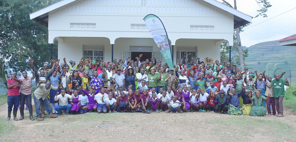 Residents of Kanungu district having a photo moment after the community dialogue on gorilla conservation at Mpungu sub-county headquarters. (Photo by Julius Luwemba)