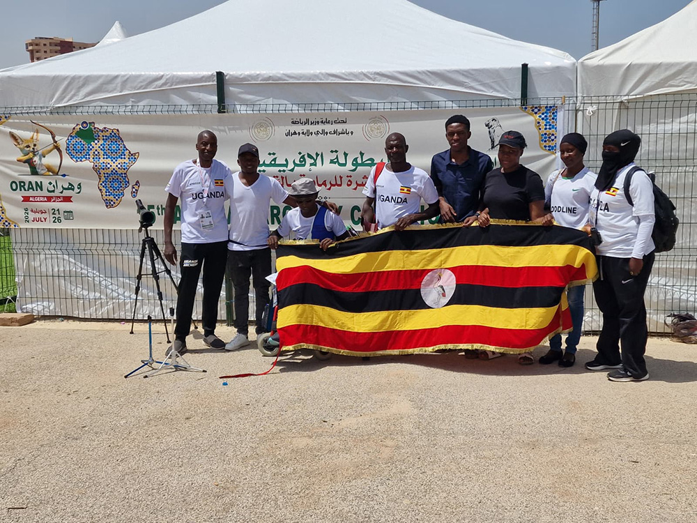 Team Uganda contingent carrying the Uganda flag. Seated is Precious Asiimwe. (Courtesy photo)