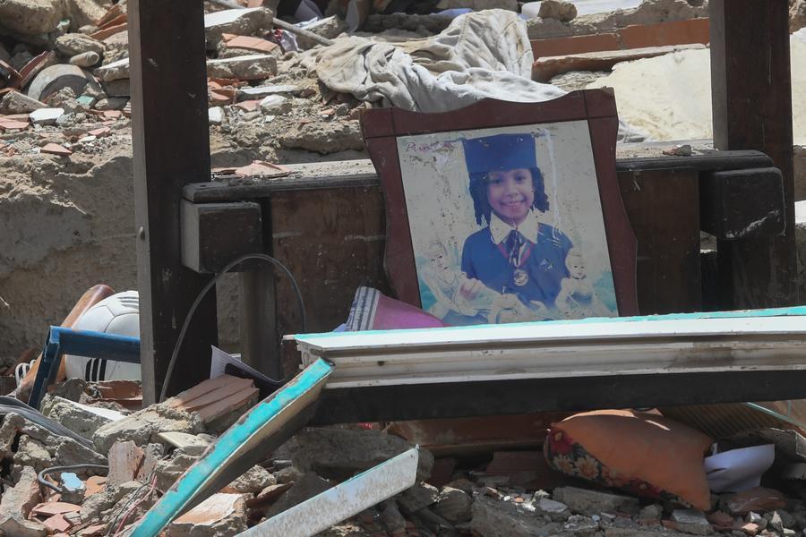 A framed photo of a girl is seen among the rubble in La Guaira State, Venezuela, June 25, 2026. 