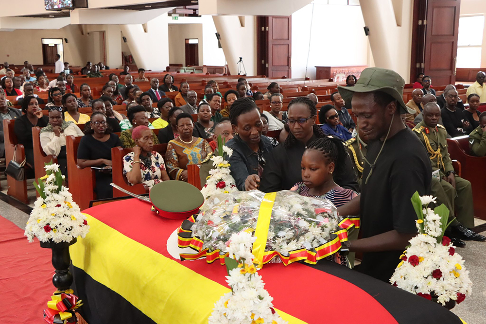 Bereaved family of the late Maj. Gen. Francis Takirwa laying a wreath on the casket during funeral service at All Saints Cathedral, Nakasero, on Feb. 11, 2026. (Courtesy)