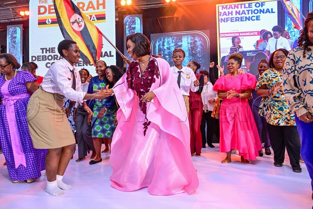  Apostle Isi Igenegba (right) joined by a student in a dance during the conference.