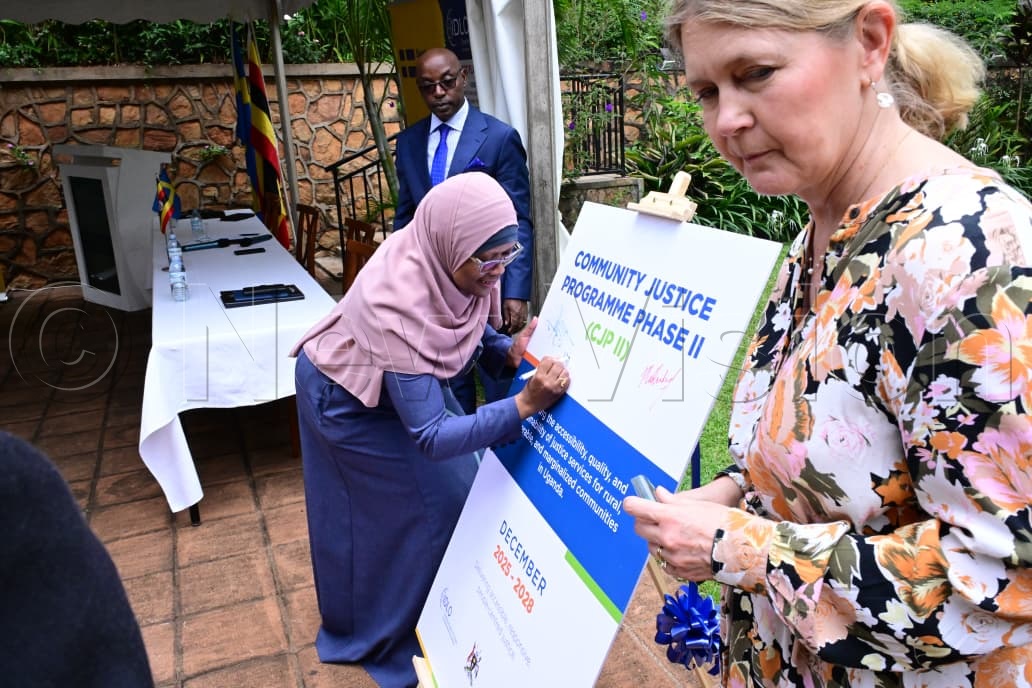 Barbara Kilei signing on the board.