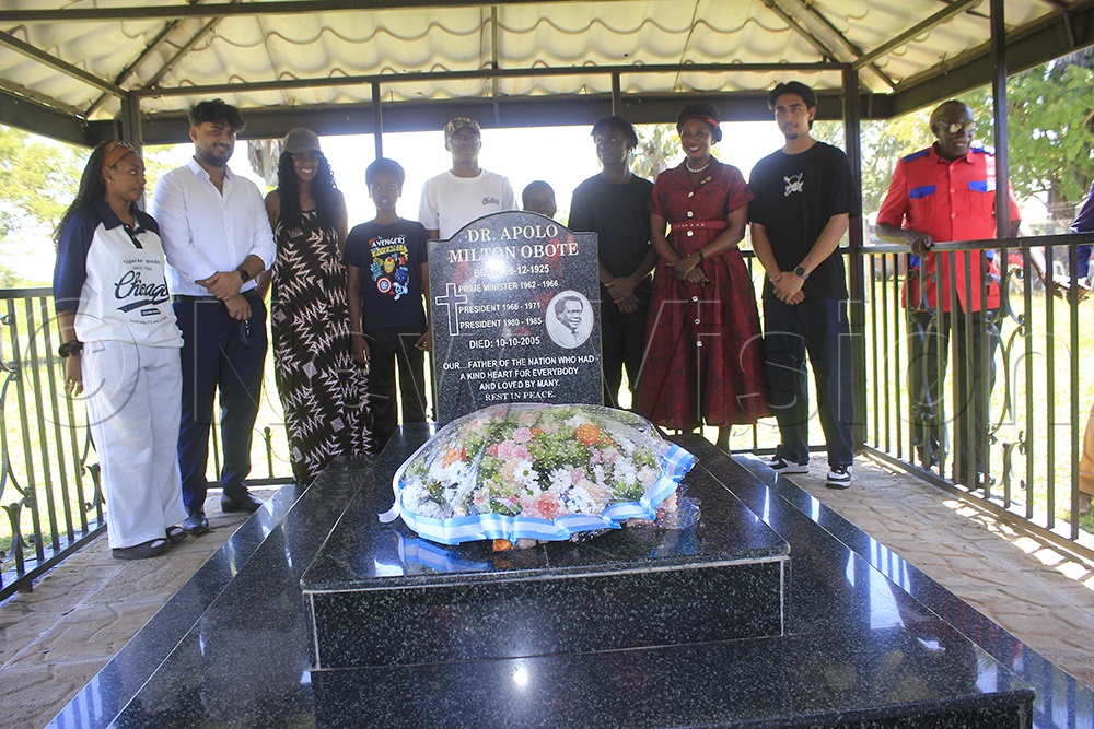 Former President Milton Obote’s grandchildren pose for a group photo at their grandfather’s gravesite. (Photo by Solomon Okabo)