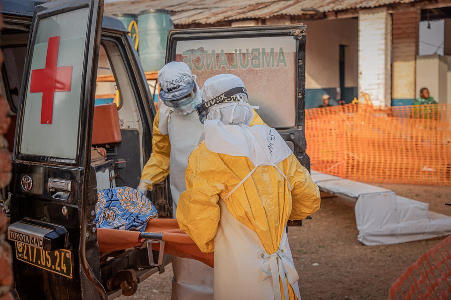 Medical workers escort an Ebola patient to an Ebola treatment center in Mongbwalu, Ituri Province, the Democratic Republic of the Congo, June 20, 2026. (Xinhua)