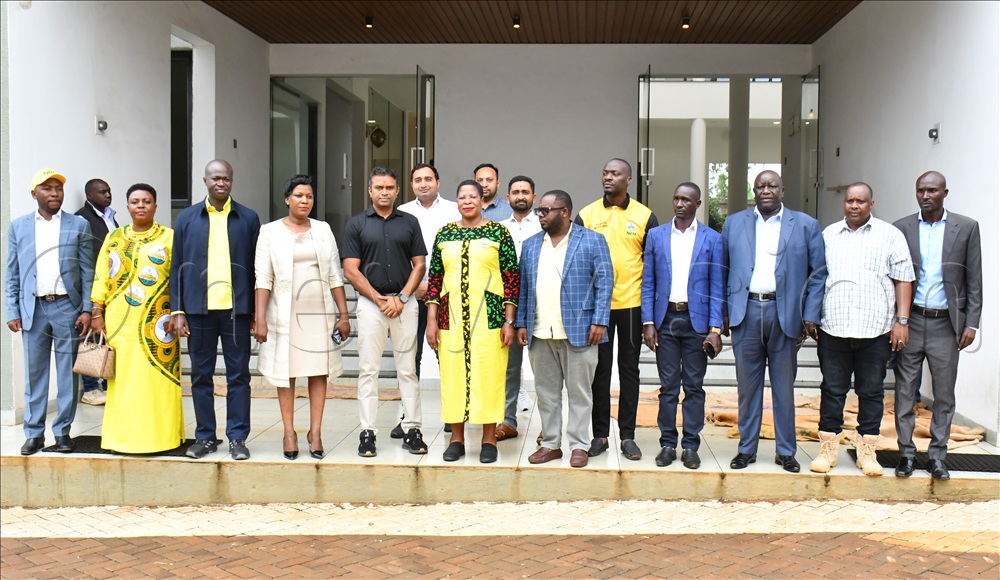 The chairperson of the Women's League on CEC Adrien Kobusingye (2nd left), PLU's Secretary General David Kabanda (3rd left), the Principal Human Resource Manager Victoria Group of Companies Elizabeth Mbeiza (4th left), and Yogi Steels Director Patel Alpesh (5th left) in a group photo with the Speaker of Parliament Anita Annet Among (middle) with other leaders in Buikwe at Yogi Steels on Thursday.  