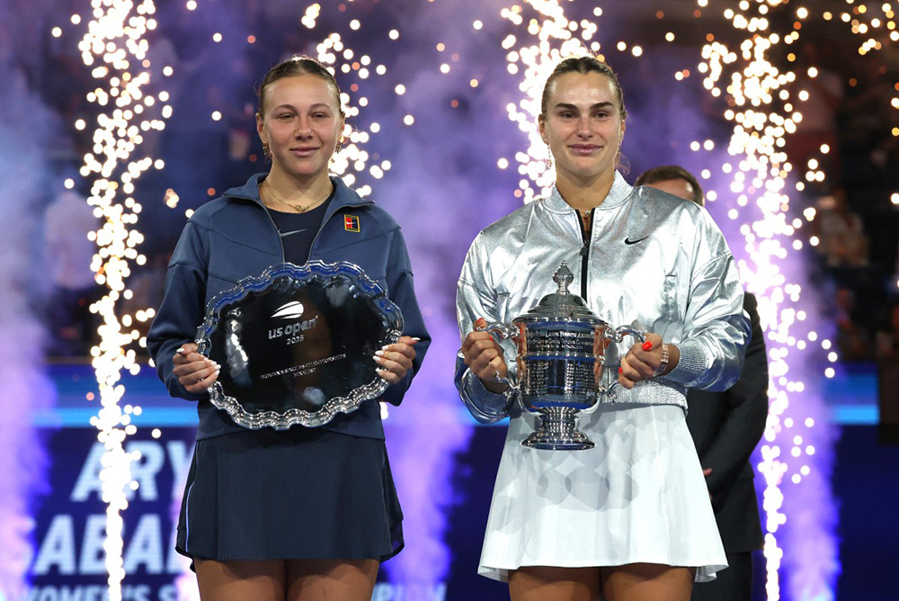Belarus's Aryna Sabalenka (R) and USA's Amanda Anisimova pose with their first and second place trophies after their women's singles final tennis match on day fourteen of the US Open tennis tournament at the USTA Billie Jean King National Tennis Center in New York City, on September 6, 2025. (Photo by TIMOTHY A.CLARY / AFP)
