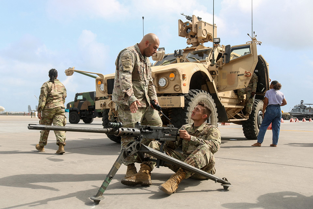 US soldiers demonstrate their equipment to the guests during celebrations of the 20th anniversary of partnerships among Djibouti and the allies at the US Camp Lemonnier in Djibouti in November 2022. (AFP)