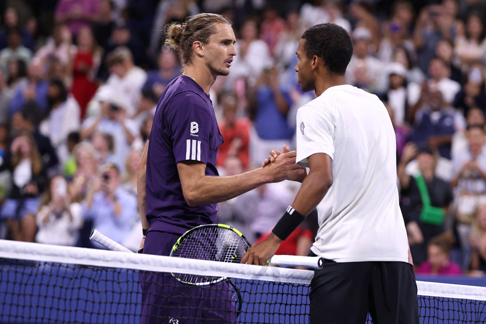 Felix Auger-Aliassime of Canada (R) greets Alexander Zverev of Germany following their Men's Singles Third Round match on Day Seven of the 2025 US Open at USTA Billie Jean King National Tennis Center on August 30, 2025. (Mike Stobe/Getty Images/AFP)