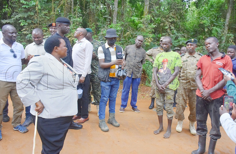 Nabbanja interrogating men who were nabbed burning charcoal from within Bugoma Central Forest on the day UWA took charge of Bugoma forest in May 2026.