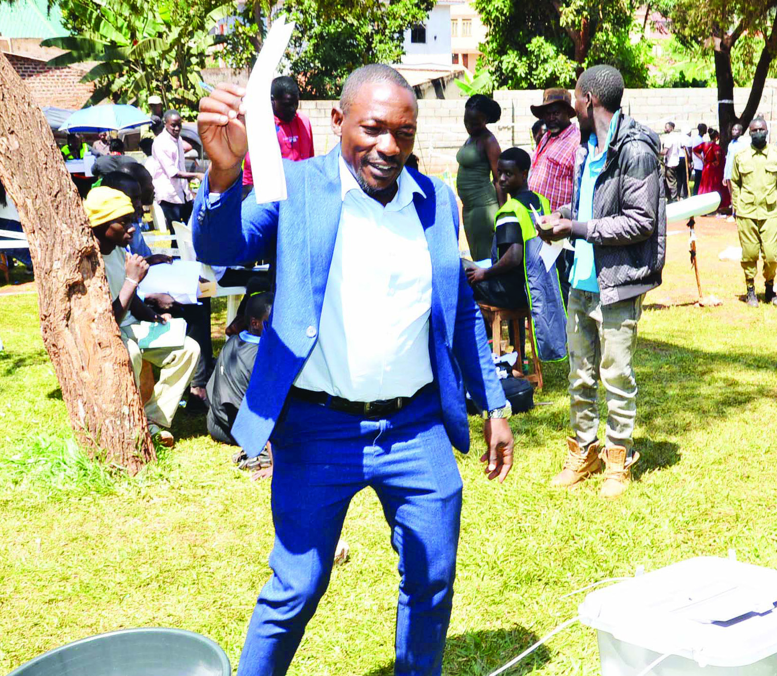Moses Lukanga Musanje, the NUP flag-bearer for Njeru Municipality, casting his vote  at Kizungu polling station in Njeru division.